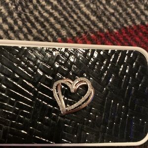 Silver and diamond double heart pendant.